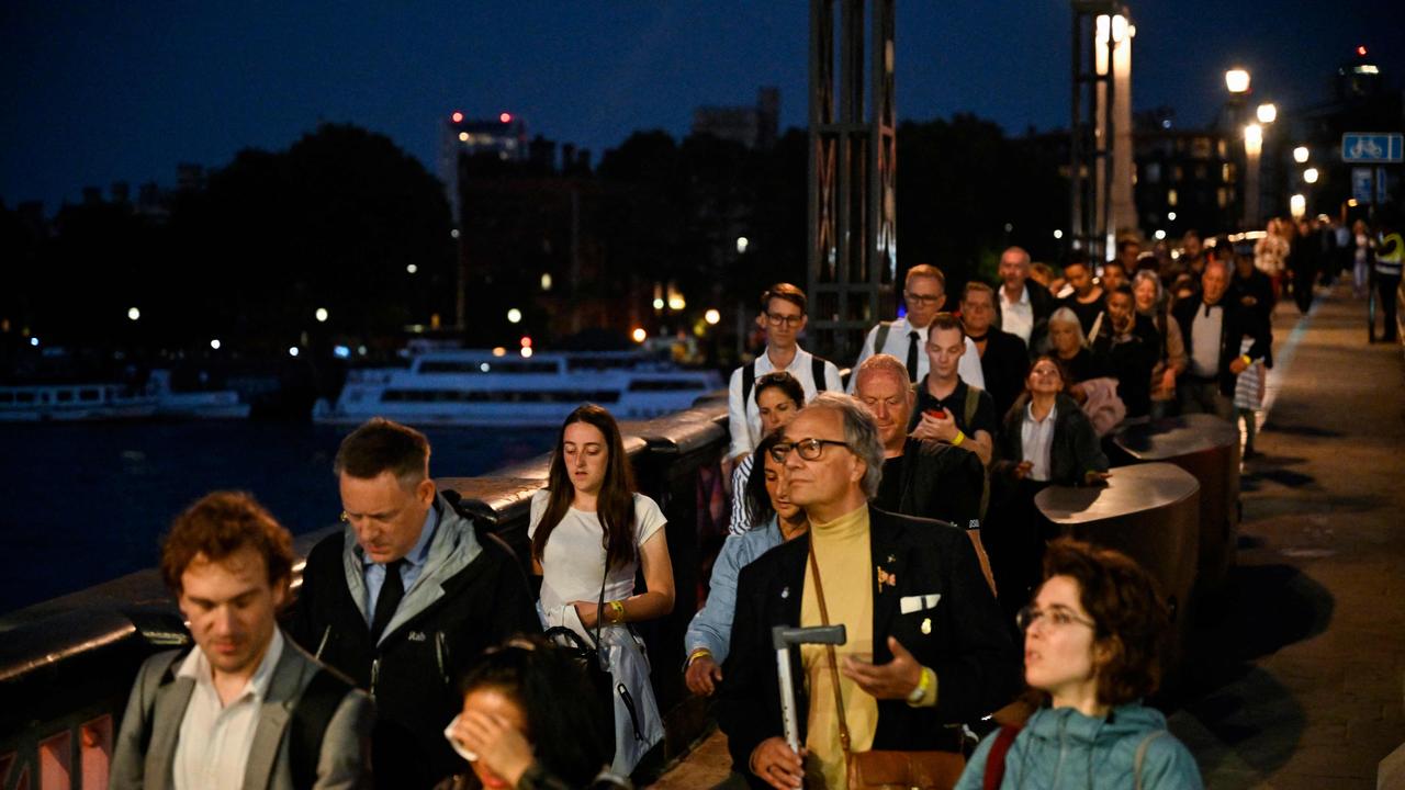 Members of the public queue on Lambeth Bridge in London on September 14, 2022 to view the coffin of Britain's Queen Elizabeth II, lying in state at Westminster Hall. Picture: Louisa Gouliamaki / AFP