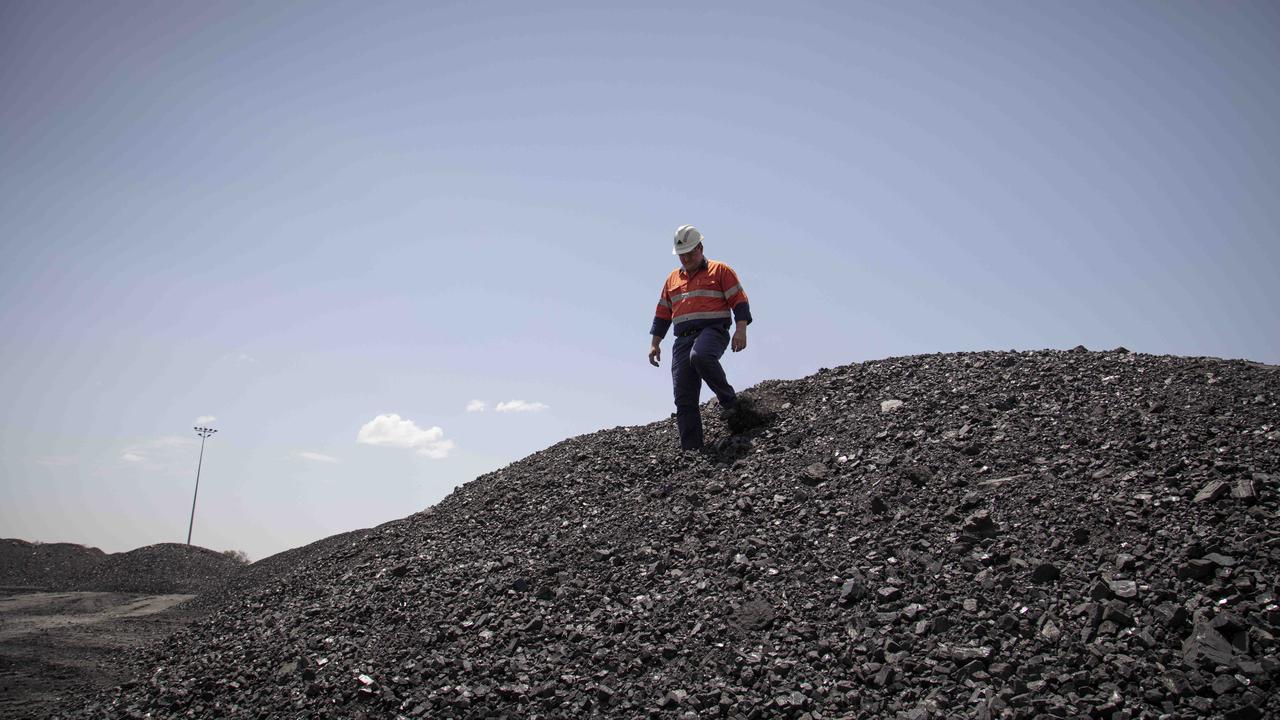 A worker at the New Acland Coal Mine stage 2 before work ceased in November this year. Picture: Russell Shakespeare