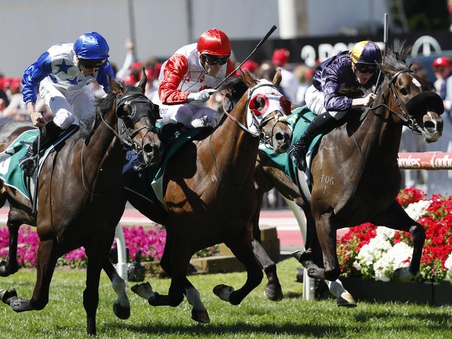 NCA. MELBOURNE, AUSTRALIA. October 26, 2024. Racing.  Cox Plate day at Moonee Valley racecourse.. Race 6. The Drummond Golf Vase.   Red Aces ridden by Jamie Mott (red cap) does enough to beat home Opening Address ridden by Ethan brown (rails) and King of Thunder ridden by James McDonald (outside)  .  Pictures : Michael Klein