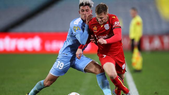 Adelaide’s Ryan Kitto tries to shrug off Lachlan Wales. Picture: Getty Images
