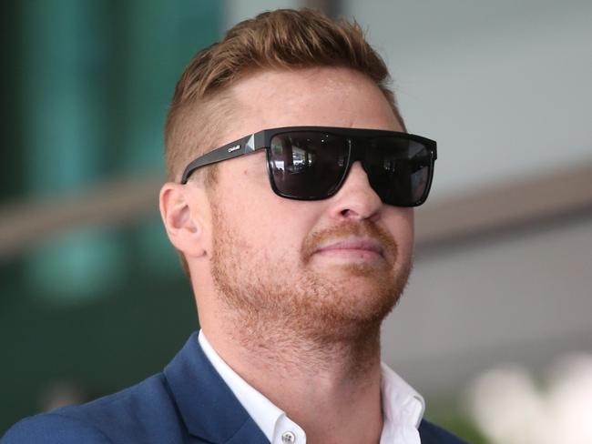 Former AFL player Colin Sylvia leaves the Melbourne Magistrates' Court in Melbourne, Monday, January 22, 2018. Sylvia, 32, pleaded guilty to several charges in Melbourne Magistrates Court on Monday, including fraudulently using the credit card details at a brothel. (AAP Image/David Crosling) NO ARCHIVING