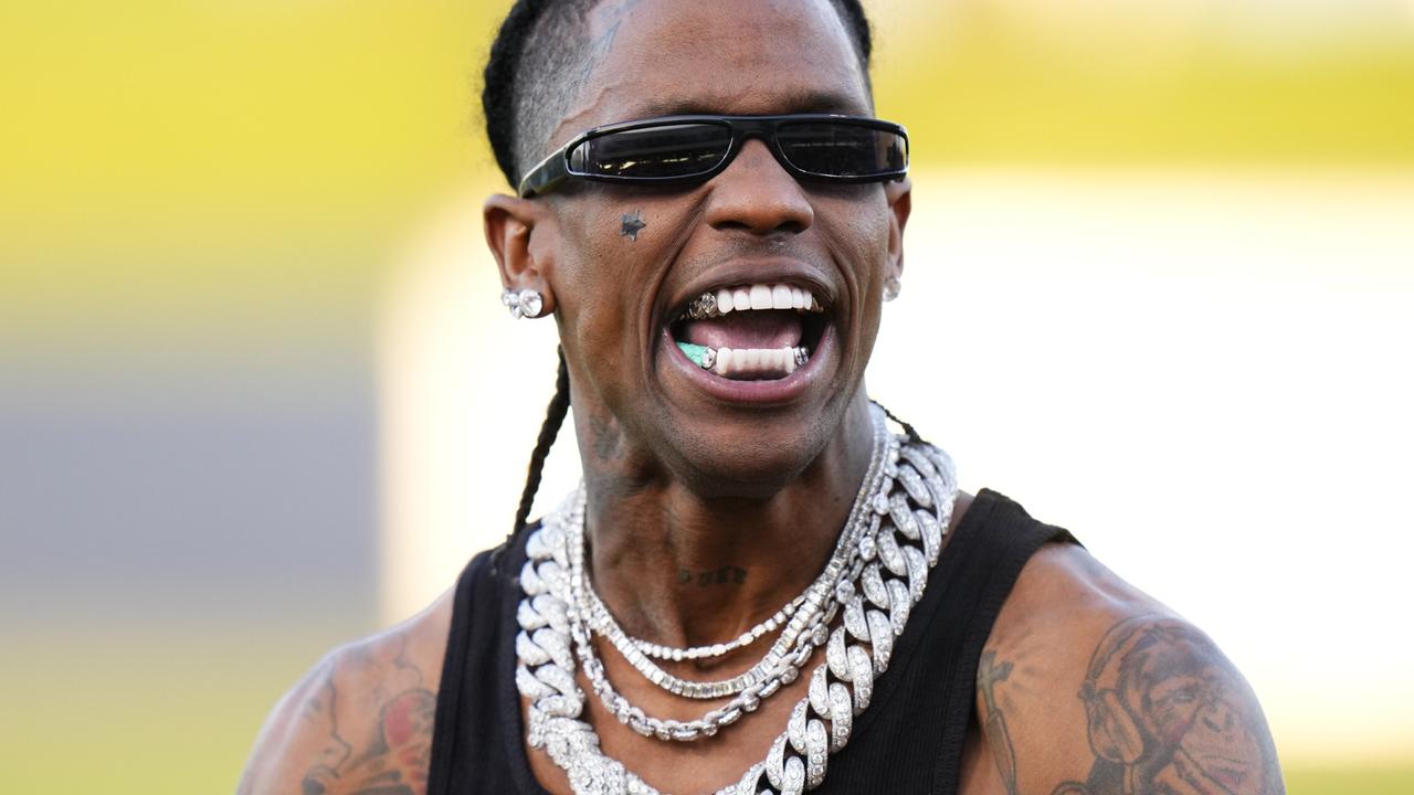 Travis Scott celebrates after throwing the opening pitch prior to a game between the Washington Nationals and the Houston Astros at CACTI Park of the Palm Beaches on February 24, 2024 in West Palm Beach, Florida. (Photo by Rich Storry/Getty Images)