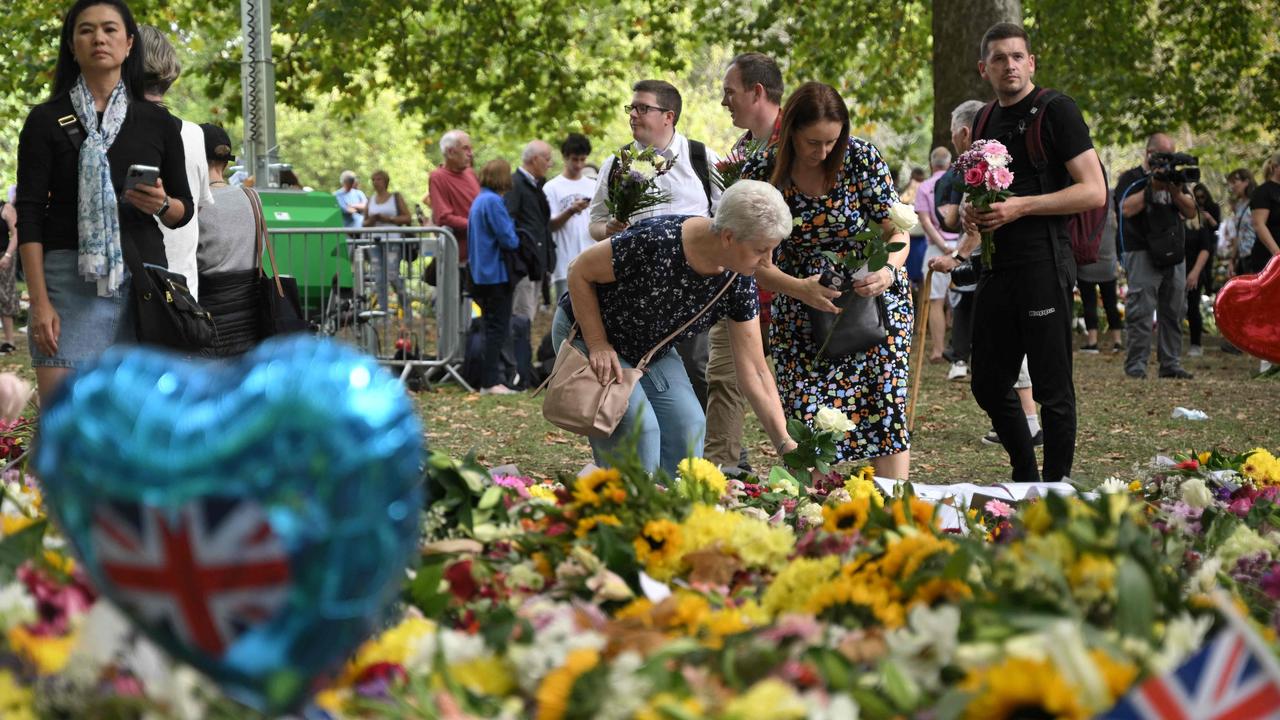 Mourners gather at the floral tribute garden at Green Park, near Buckingham Palace, for a quiet reflection following the Queen’s death. Picture: Loic Venance/AFP