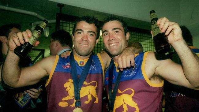 Chris and Brad Scott celebrate Brisbane’s 2002 grand final win