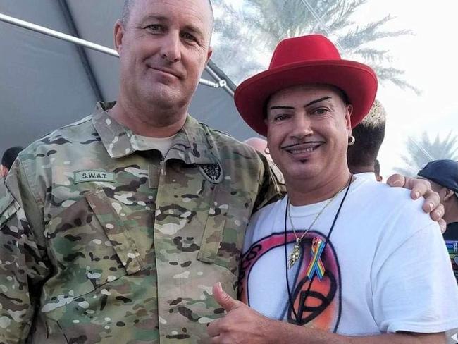 Orlando Torres (right) with John who was part of the SWAT team that saved him and others.