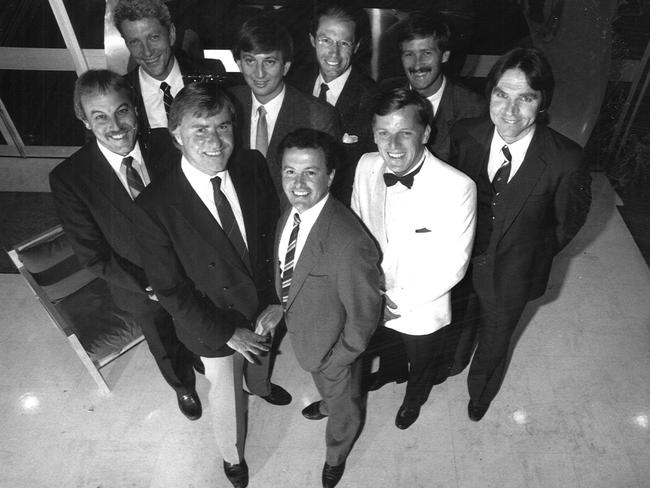 The 1987 Channel 7 commentary team (back left): Peter Landy, Dennis Cometti, Don Scott, Bernie Quinlan and Peter McKenna. Front: Malcolm Blight, Ian Robertson Drew Morphett and Sandy Roberts