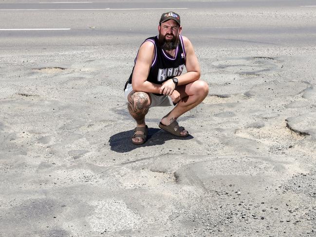 Ryan Cumberland says every single main road in Wallan is riddled with potholes. Picture: Ian Currie