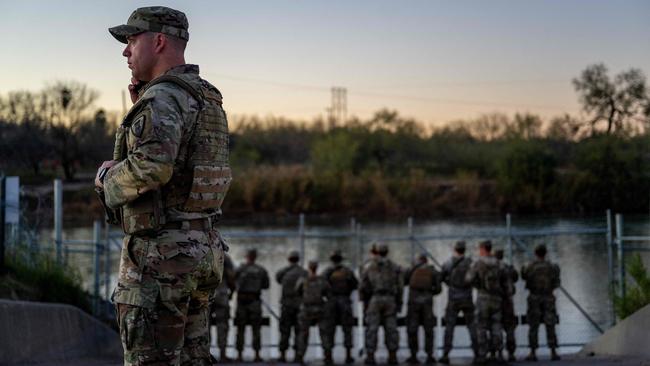 Texan National Guard at the disputed point on the banks of the Rio Grande in Eagle Pass lat week. Picture: AFP