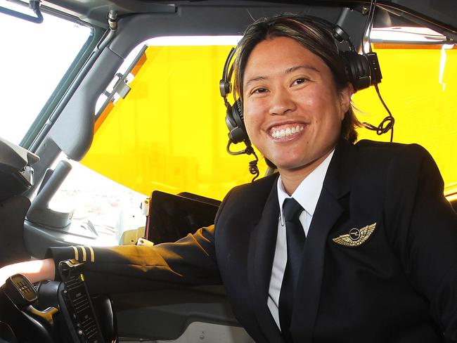 First Officer Boeing 737-800 Haidee Wong poses in the cockpit of a Boeing 737 at Brisbane Airport. QANTAS is hosting the first of a series of training days for women, kicking off in Brisbane as it seeks to address a looming pilot shortage. Photo: Claudia Baxter