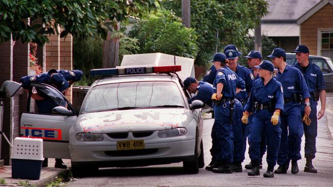 Police outside house the home on Doran Street at Carrington the day after the bodies of Susan Kay and Joanne Teterin were discovered on May 17, 2000. A coroner would later rule they were murdered on May 11, 2000. Picture: Robert McKell.