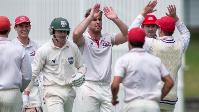 Lucas Dredge celebrates a wicket with teammates. Picture: Christopher Chan