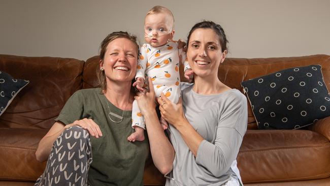 Shannon Trenwith and Kim Spragg with daughter Agnes. Picture: Brad Fleet