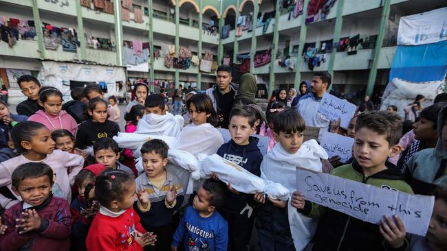 Palestinian children in the Gazan city of Rafah march in a protest demanding an end to the war. Picture: Ahmad Hasaballah / Getty Images