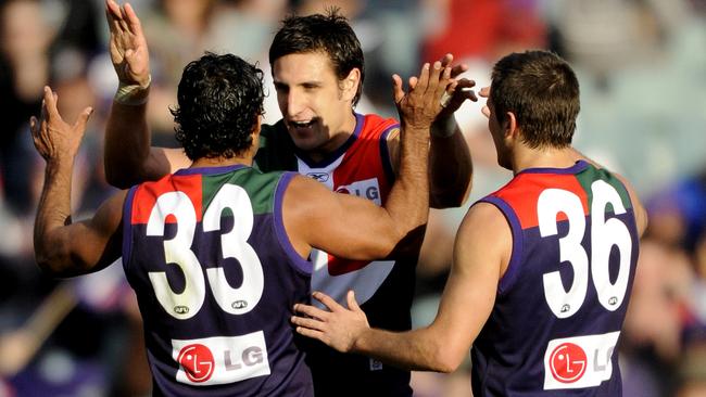 Matthew Pavlich celebrates a goal with teammates Jeff Farmer and Andrew Browne against the Demons in 2008. PICTURE: JACKSON FLINDELL .