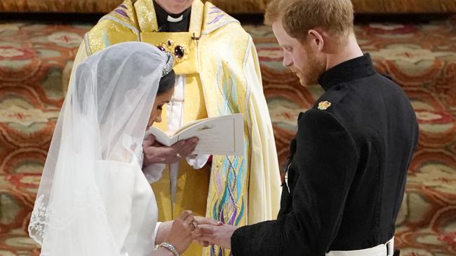 Meghan Markle and Prince Harry during their wedding ceremony on Saturday. Picture: AFP                        <a capiid="96e9a5d3646ea6e0bc36f50d39a13161" class="capi-video">Markle's dress designer: "She was absolutely radiant"</a>