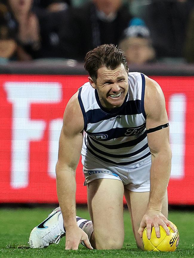 Dangerfield in pain after the clash with Port’s Houston. Picture: Sarah Reed/AFL Photos via Getty