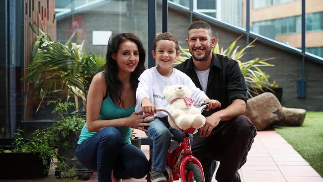 Ta’Liek El-Rez, 5, with his mum and dad, Hayley Coomber and Bill El-Rez, and a bear that has pre-recorded messages from his parents. Picture: LUKE BOWDEN