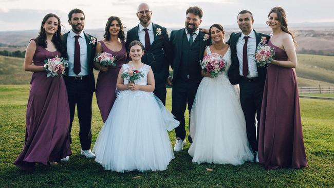 Both the bride and groom and the wedding party wore custom New Balance 1500’s sneakers. Picture: Timmy Smalls