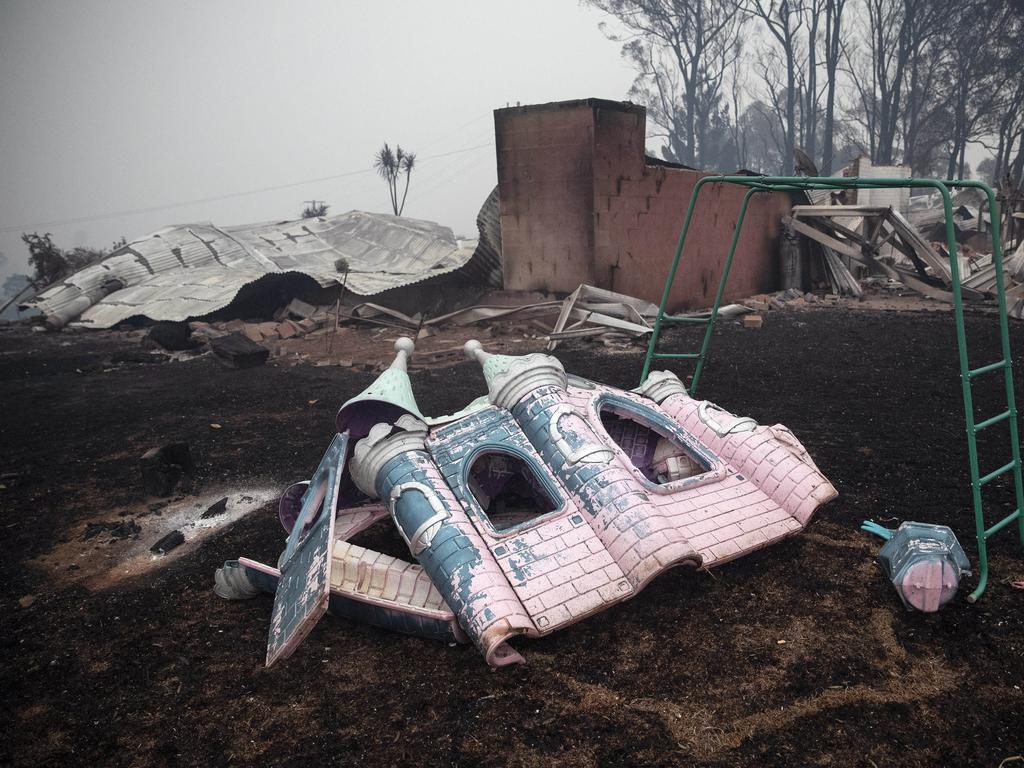 The morning after a devastating blaze destroyed homes and businesses in the small town of Cobargo. The town has been decimated by fire. A melted children's play castle in the backyard of a burnt property. Picture Gary Ramage