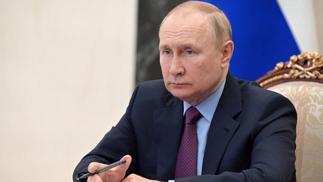 Vladimir Putin chairs a meeting on the development of the country's metallurgical sector via a video conference at the Kremlin this week. Picture: AFP