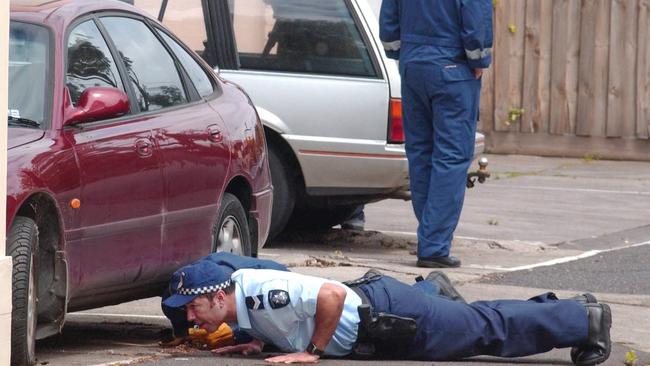 Police search Joy St, South Yarra, after the shooting murder of Michael Marshall.