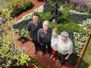 Chronicle Garden Competition city garden judge Lawrie Smith (second from left) chats with entrants in Primrose St Peter Kotzur (left) and Del and Alf Wagland. Picture: Bev Lacey