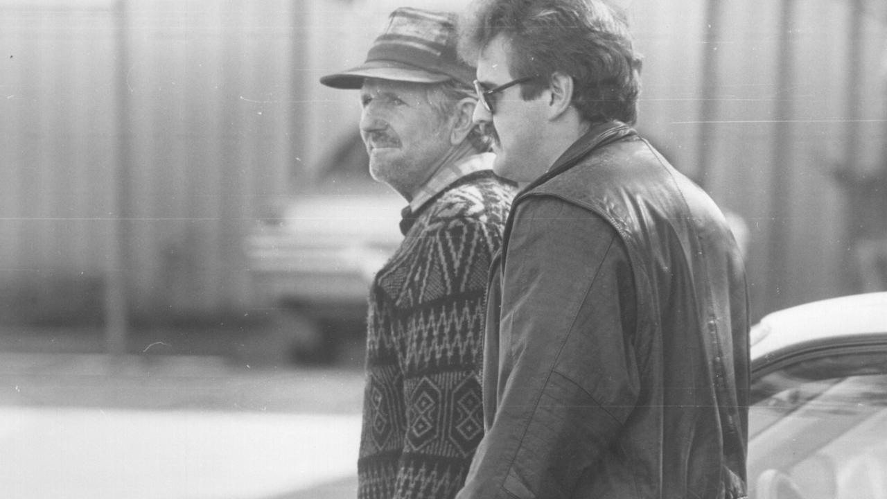 Frank Abbott (left, in hat) in 1968 after the murder of Helen Harrison, 17, whose body was found on a timber cutter’s road in the Blue Mountains.