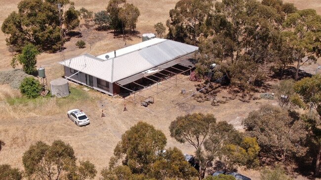 An aerial shot showing the house and surrounding area.