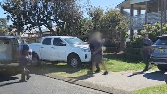 Man arrested in Anna Bay, Port Stephens, over an alleged holiday rental scam involving 31 alleged victims and around $500,000. Credit: NSW Police