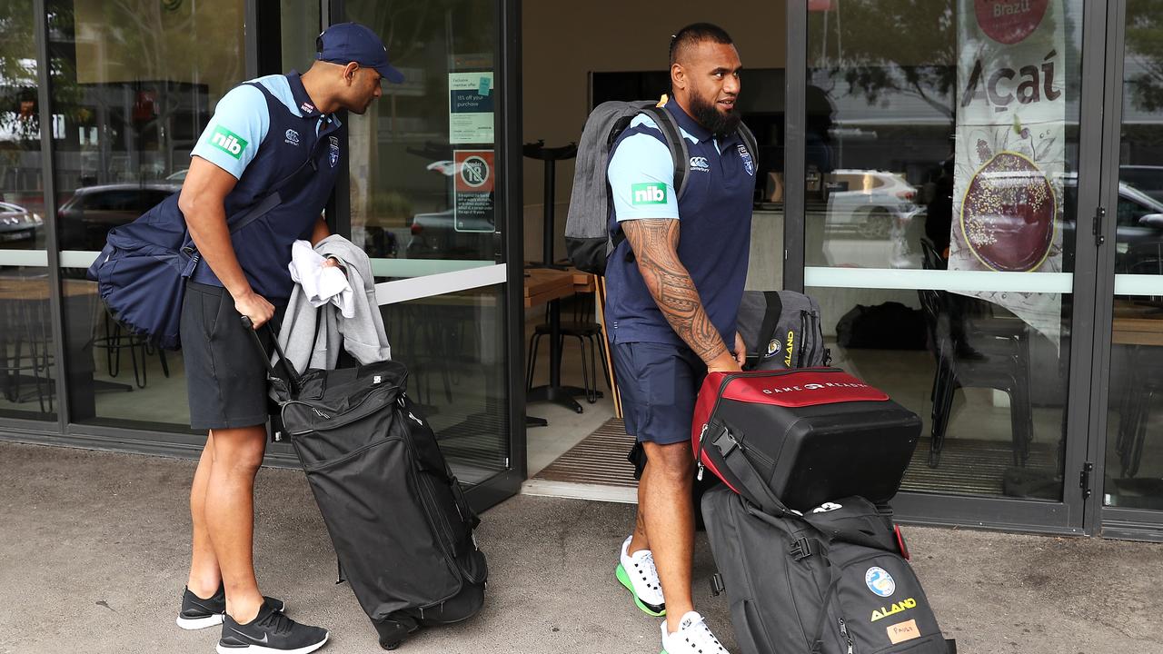 Daniel Tupou and Junior Paulo take thier luggage to the bus during day one of New South Wales State of Origin training at the NSWRL Centre of Excellence (Photo by Mark Kolbe/Getty Images)