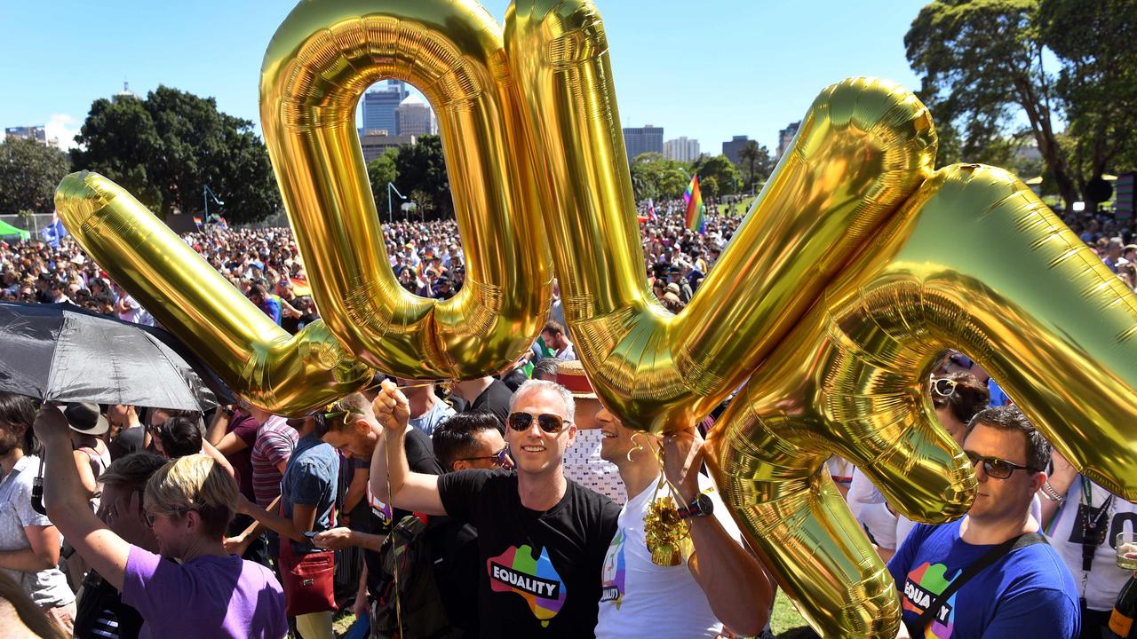 Supporters of the same-sex marriage vote gather to celebrate the announcement in a Sydney. Picture: William West/AFP