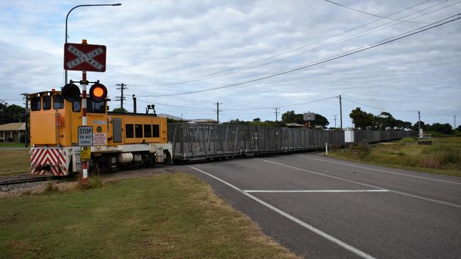 A Wilmar Sugar Australia cane train towing empty cane bins from Victoria Mill through Ingham, Hinchinbrook Shire. Picture: Cameron Bates