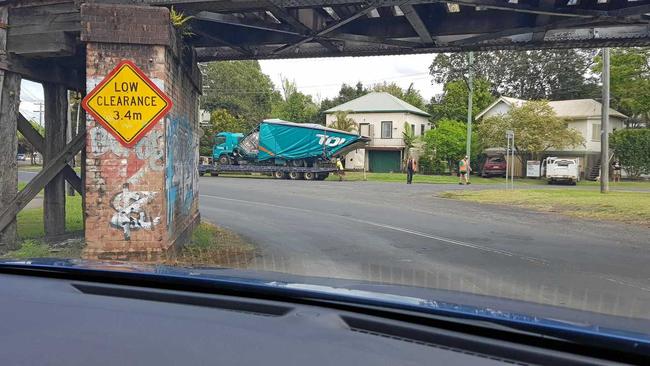 TRUCK SQUEEZE: A truck driver had a lucky escape when their vehicle failed to pass under a low bridge in South Lismore on Wednesday. Picture: Supplied