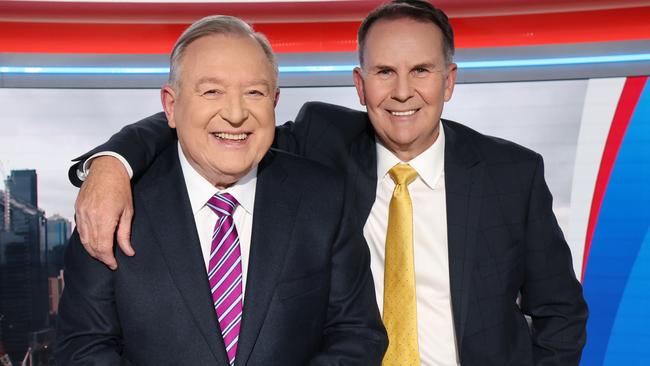 Peter Hitchener with sports presenter Tony Jones after the last news bulletin. Picture: David Caird