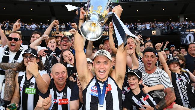 Darcy Moore lifts the cup. Picture: Quinn Rooney/Getty Images