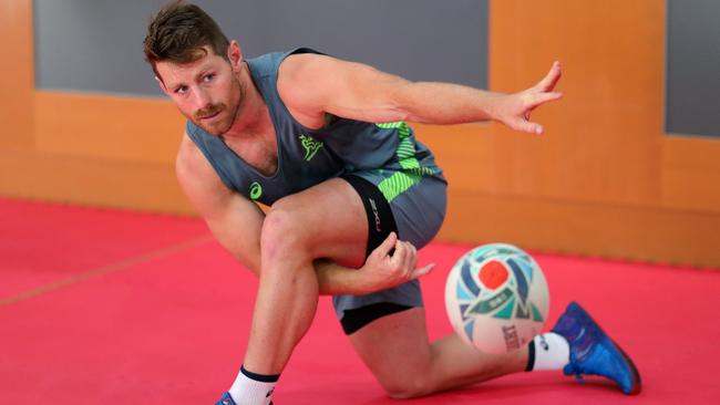 Bernard Foley practices his passing during a gym session. Picture: Getty Images