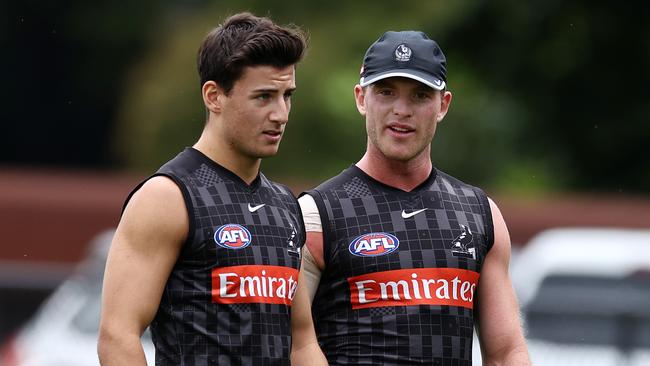 Tom Mitchell passes on some tips to Nick Daicos. Picture: Michael Klein