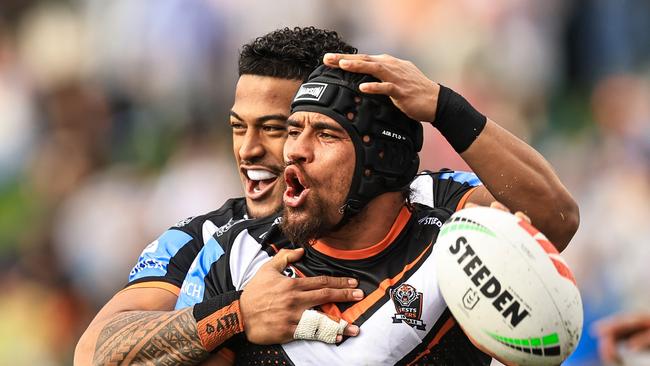 TAMWORTH, AUSTRALIA - MAY 11: Isaiah Papali'i of the Tigers celebrates a try with team mates during the round 10 NRL match between Wests Tigers and Newcastle Knights at Scully Park, on May 11, 2024, in Tamworth, Australia. (Photo by Mark Evans/Getty Images)