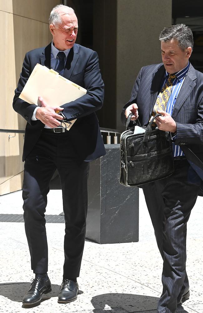 Gold Coast lawyer Beau Hartnett (left), with his barrister Richard Cowen, leaves the Federal Court in Brisbane on Tuesday. Picture: NewsWire / John Gass