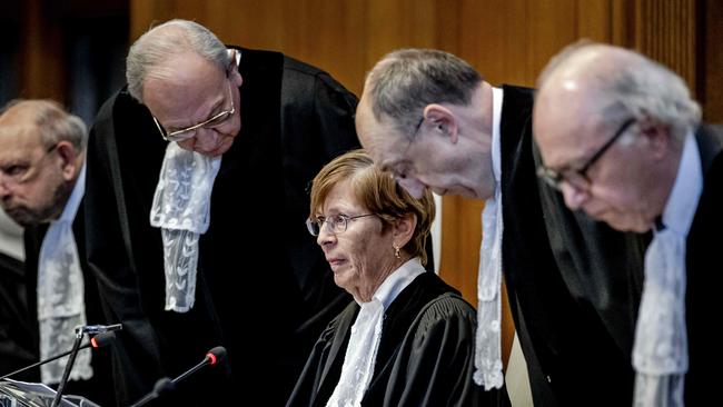 ICJ President Joan Donoghue, centre, and judges arrive at the International Court of Justice prior to the verdict announcement in the genocide case against Israel, brought by South Africa, in The Hague on January 26. The top UN court said Israel should do everything it could to prevent any acts of genocide in the Gaza Strip, in a highly anticipated ruling. Picture: Remko de Waal/ANP/AFP