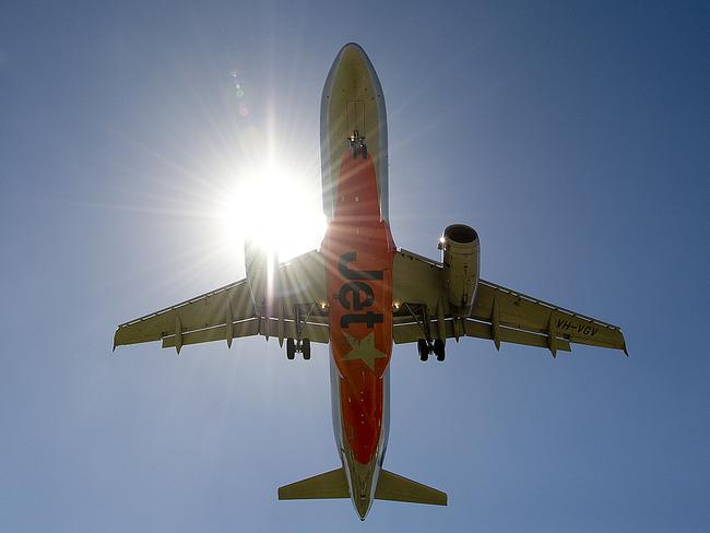 Stock photo of a Jetstar plane flying on approach to Coolangatta airport on the Gold Coast, Friday, March 21, 2014. (AAP Image/Dave Hunt) NO ARCHIVING