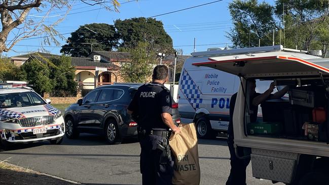 Police take evidence from the crime scene.