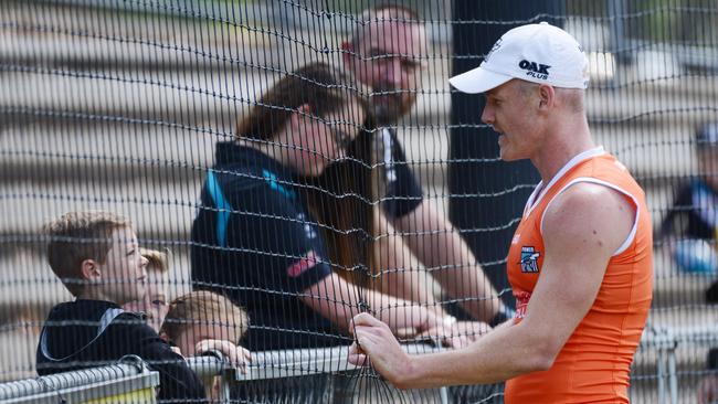 Robbie Gray chats to a young fan during Port Power training at Alberton Oval. Picture: AAP Image/ Brenton Edwards