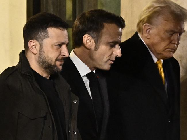 Ukraine's President Volodymyr Zelenskyy, pictured here in December with Mr Trump and French president Emmanuel Macron, has hit out at the reported plan. Picture: AFP