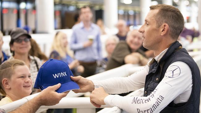 Jockey Hugh Bowman greets Winx fans after the Randwick hit out. Picture: Darren Leigh Roberts