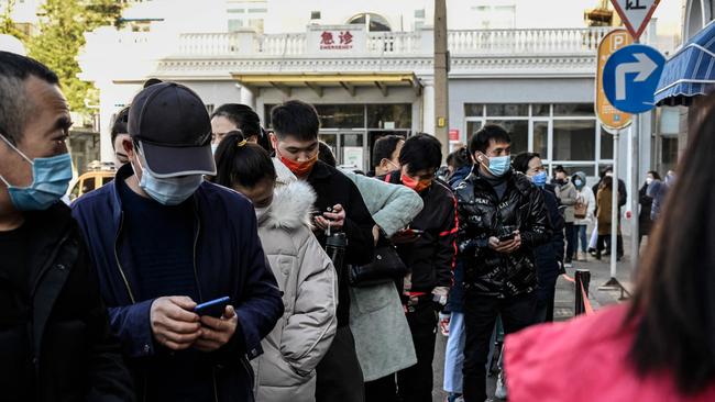 People line up to be tested for the Covid-19 coronavirus outside a hospital in Beijing. Picture: Jade GAO