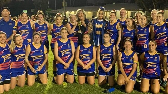 Kylie Bazzo posing with the South Mandurah Football and Netball Club women's side following their win in the annual Bazzo cup, named after Kylie's late husband Steve.