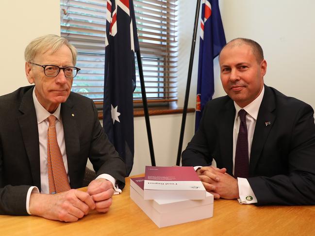 Commissioner Kenneth Hayne and Treasurer Josh Frydenberg with the final report from the Royal Commission into Misconduct in the Banking, Superannuation and Financial Services Industry. Picture: Kym Smith