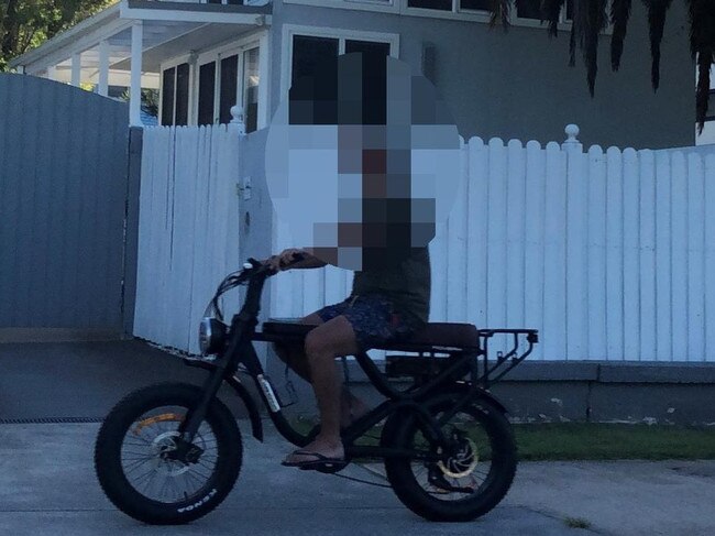 A man, wearing things and no helmet, on an e-bike on the shared path along Pittwater Rd, North Manly. Picture: Jim O'Rourke