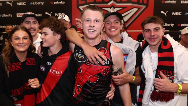 Clarke with family and friends in the rooms after the game. Picture: James Wiltshire/AFL Photos via Getty Images